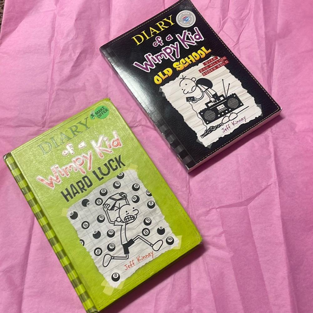 What book is black and one book is green